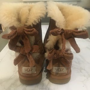 Ugg boots with fur and tan bows